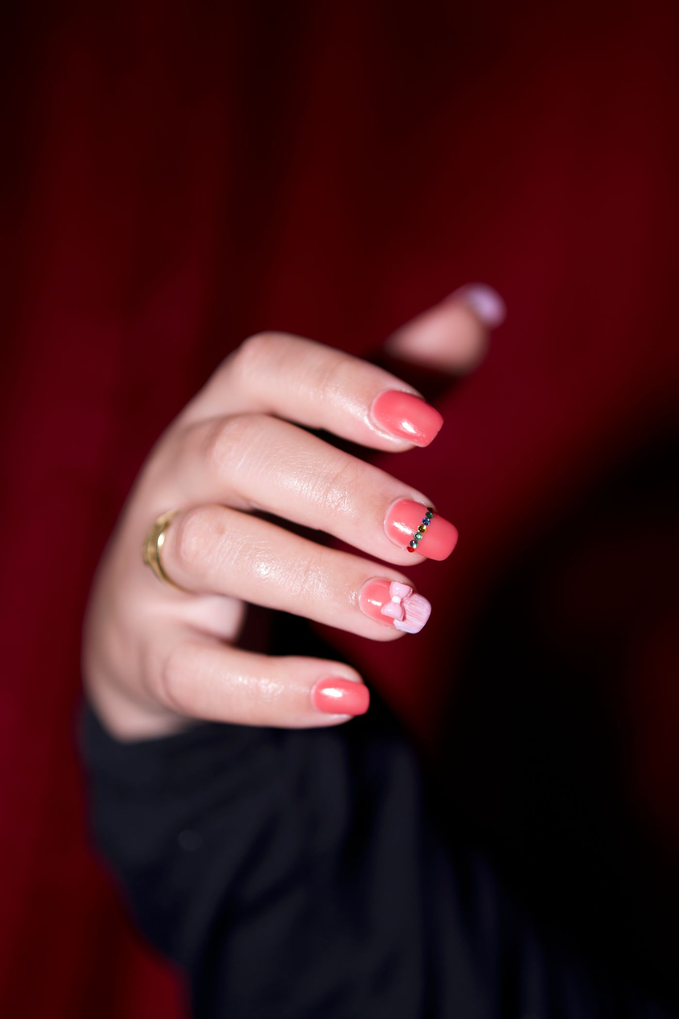 Floral nail art detail on a manicured hand