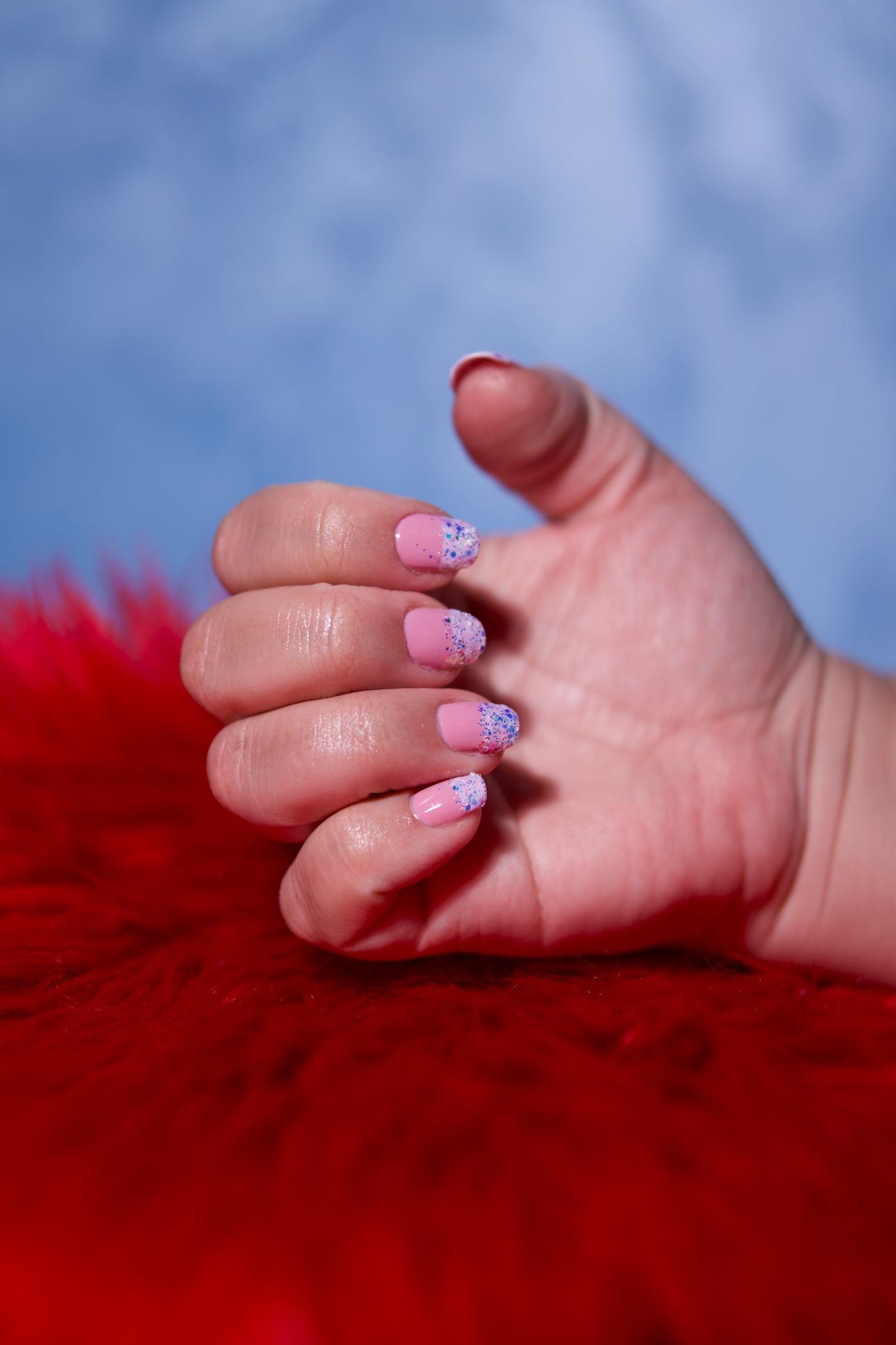 Pink glitter nail art close-up